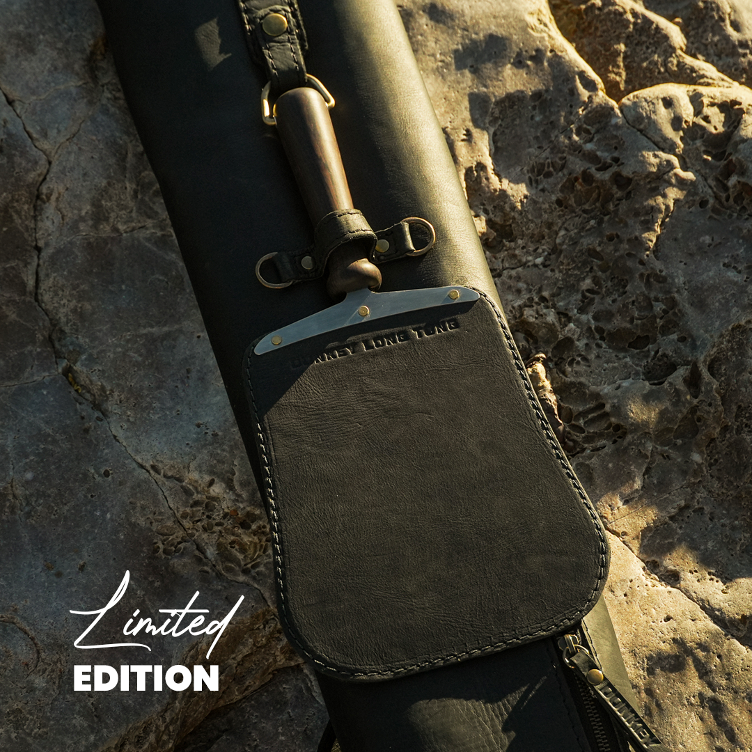 Black Paddle on a Black Sack on a rock Surface.