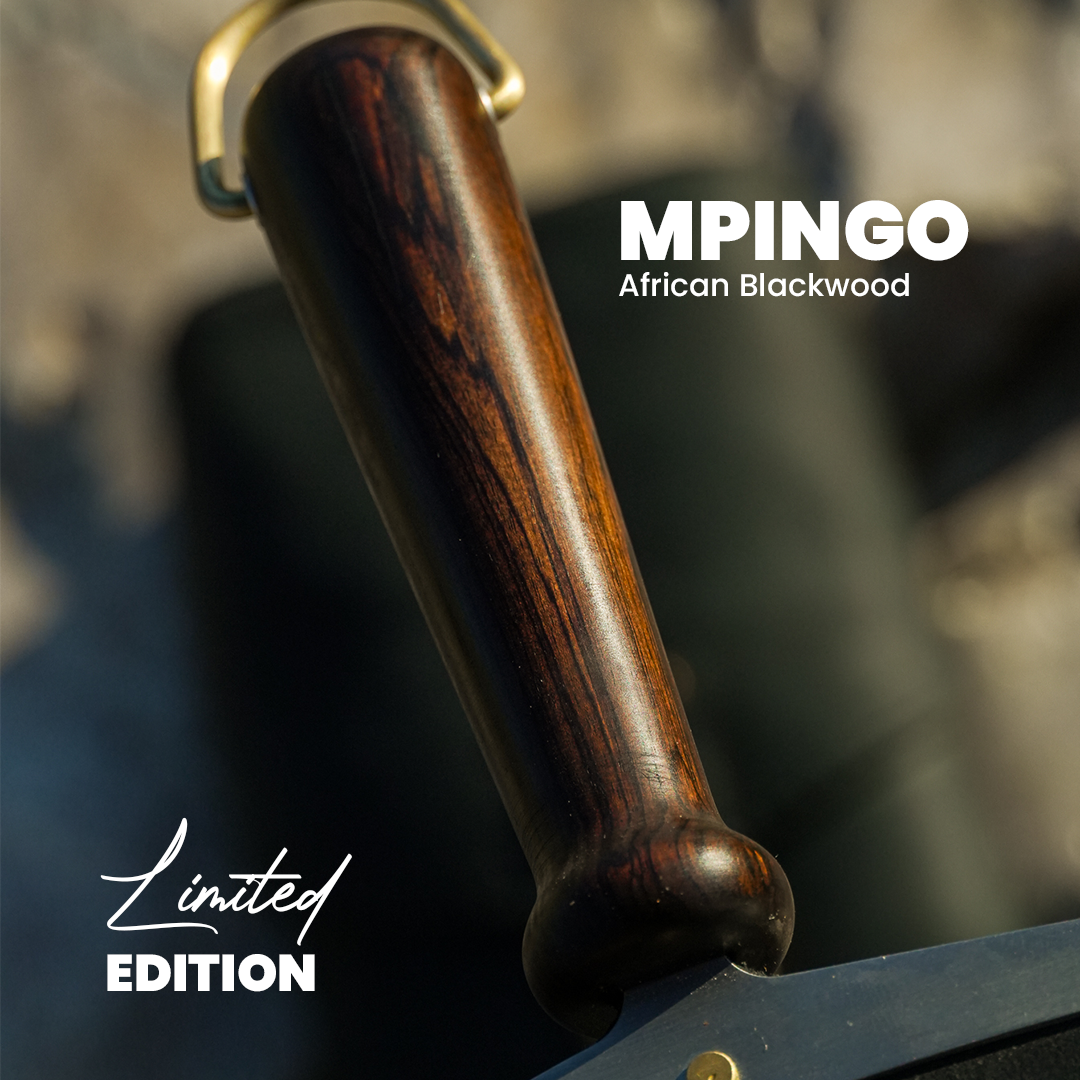 A handle of The Paddle made out of Mpingo African Blackwood.