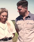 A couple putting on their tjop and tjoppie caps.